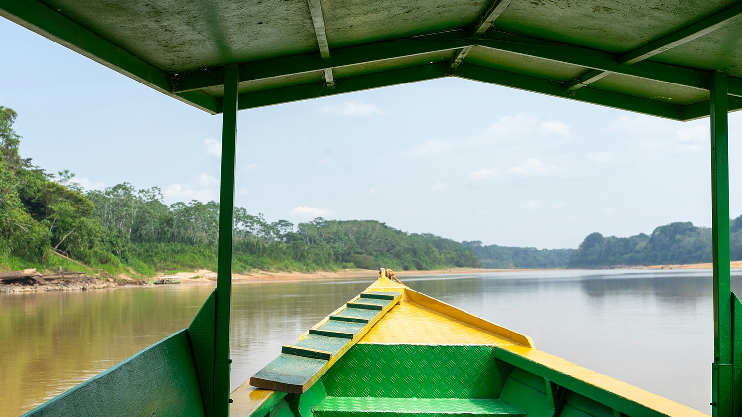 Boat on an amazonian river, Tambopata, Peru